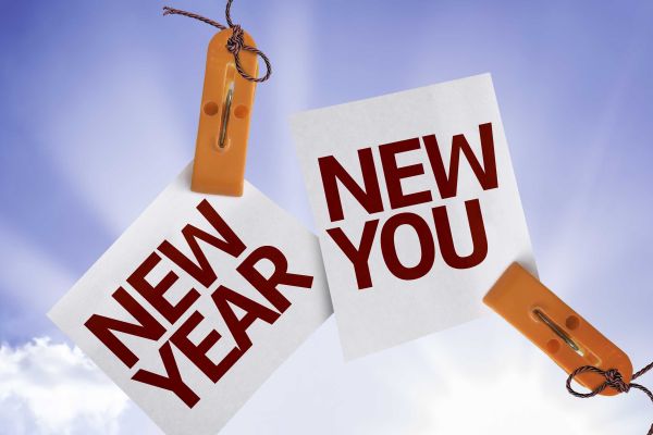 pieces of paper that say new year and new you